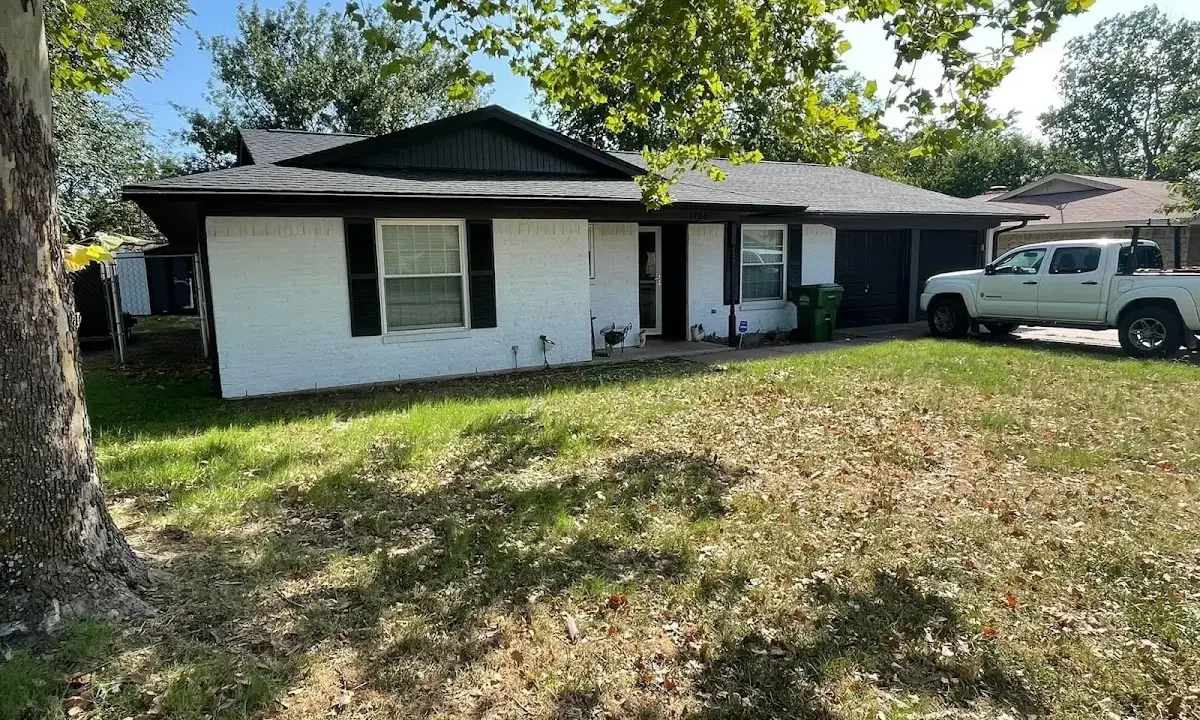 Professional roofing crew working on a residential roof in San Mateo